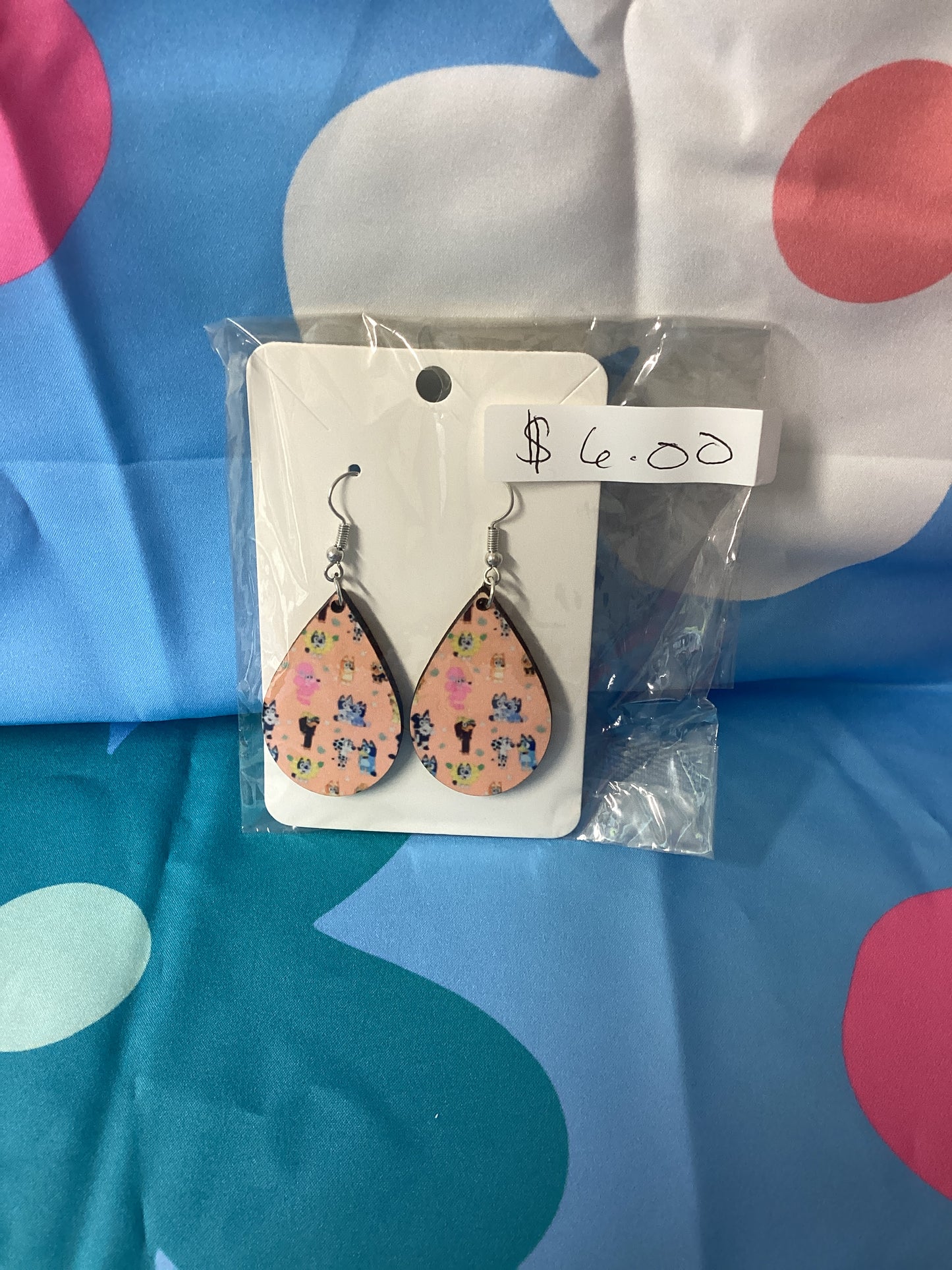 Blue dog pink background Earrings