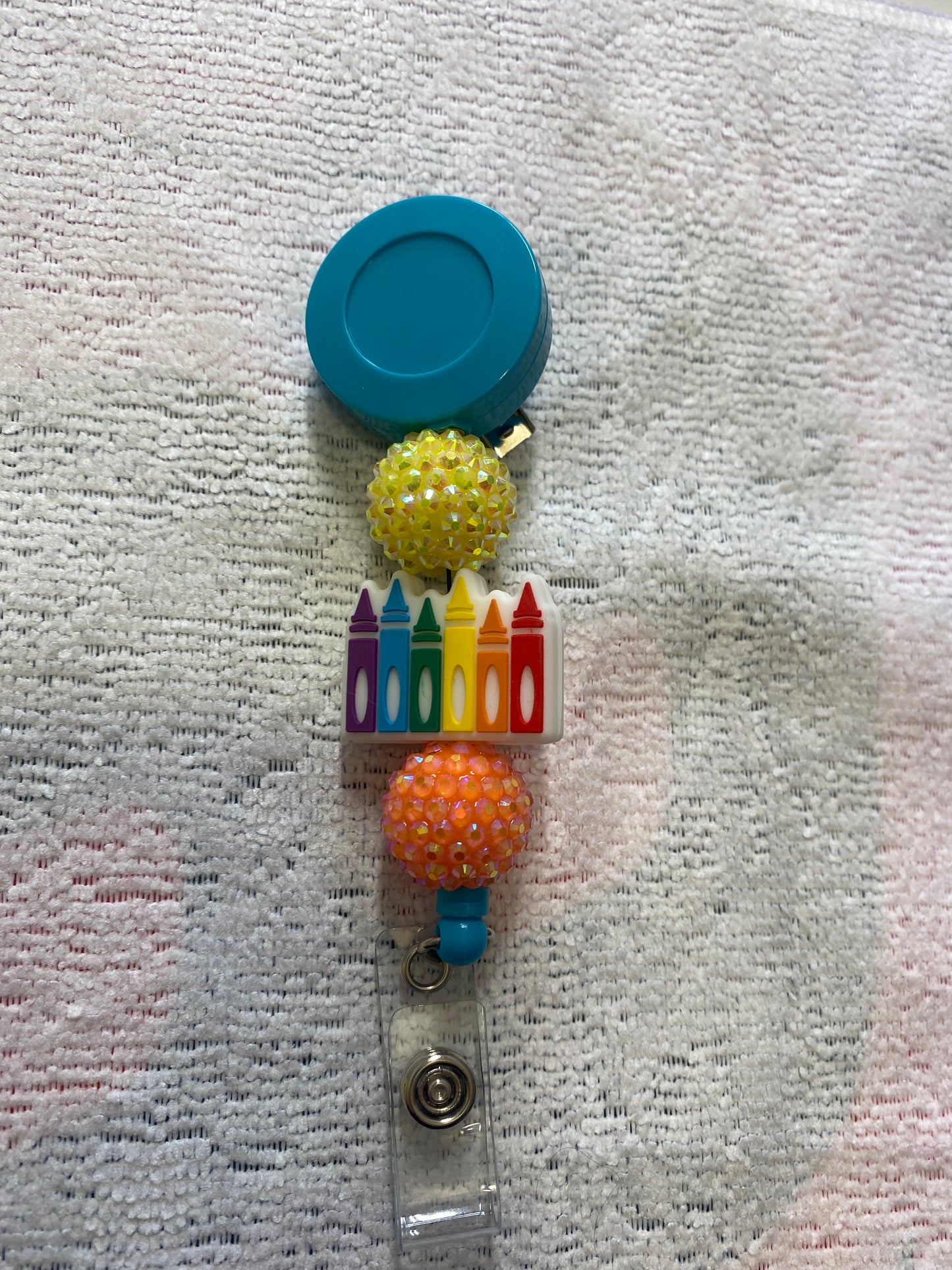 Crayon badge reel